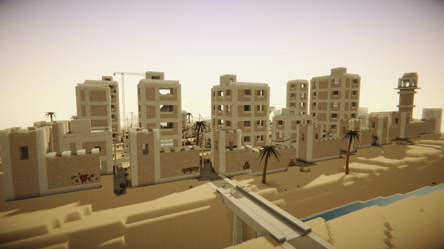 Ruined apartment blocks behind a fortified wall with DANGER graffiti